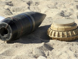 A Static Display of a Converted Ordnance Shell and a Simple Mine