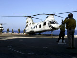 Personnel Walk into the Rear of a CH-46E Sea Knight Helicopter