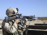 US Marine Sites Through the Scope Atop His 556mm M16A2 Rifle
