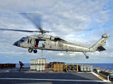 An MH-60s Seahawk Helicopter Prepares to Deliver Ammunition