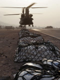 Marine Specialists Attach Sling Loads to the Body of an Army CH-47 Chinook Cargo Helicopter