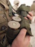A Marine Cradles Handfuls of 40 mm Grenades During a Training Exercise