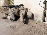 A Combat Engineer Searches for Possible Improvised Explosive Devices and Weapons Caches