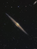 NGC 4565 is an Edge-On Barred Spiral Galaxy in the Constellation Coma Berenices