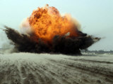 An Explosion Erupts from the Detonation of a Weapons Cache