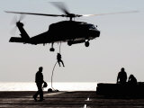 Personnel Fast-Rope out of an SH-60F Seahawk Helicopter