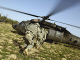 US Army Soldiers Prepare to Board a UH-60 Black Hawk Helicopter