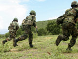 Royal Thai Marines Rush Forward to Secure the Site During an Amphibious Raid Exercise