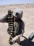 A Marine Handles a String of 40 mm High-Explosive Grenades