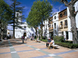 People Relaxing in Church Square in Front of the El Salvador Church
