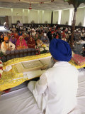 Sikh Priest and Holy Book at Sikh Wedding  London  England  United Kingdom