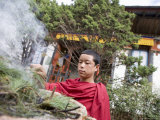 Buddhist Monk Burning Incense  Sey Lhakhang Temple  Bumthang  Bhutan Asia