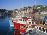 Fishing Boats and Waterfront with Mccaig's Tower on Hill  Argyll  Scotland  UK
