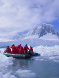 Tourists Ice Cruising in Rigid Inflatable Boat Approaching Crabeater Seal  Antarctica