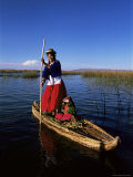Uros Indian Woman and Traditional Reed Boat  Islas Flotantes  Lake Titicaca  Peru  South America