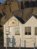 Shadow of Couple Walking Past Beach Huts  Granite Boulders  Cote De Granit Rose  Brittany