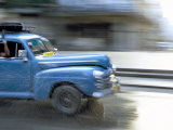Panned Shot of Old American Car Splashing Through Puddle on Prado  Havana  Cuba  West Indies