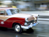 Panned Shot of Old American Car Splashing Through Puddle on Prado  Havana  Cuba  West Indies