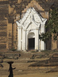 Silhouette of a Woman with Tray on Her Head Walking Past Stupa Entrance  Near Mandalay  Myanmar