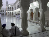 Two Sikhs Priests at Dawn Sitting Under Arcades  Golden Temple  Amritsar  Punjab State  India