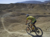 Back View of Competitior Riding Downhill in Mount Sodom International Mountain Bike Race  Israel