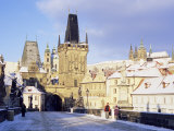 Snow-Covered Gothic Charles Bridge with Baroque Statues  Mala Strana  Czech Republic