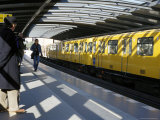 Passengers on the Platform and a Yellow Train  Mendelsshon U-Bahn Station  Berlin  Germany