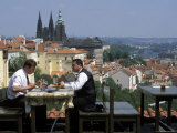 Two Men Having Lunch Outdoors  Enjoying the View of Prague Castle from the Restaurant Ozivle Drevo