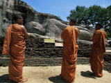 Three Monks in Front of a Statue of the Buddha  Gal Vihara  Polonnaruwa  Sri Lanka