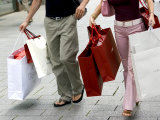 Couple Walking with Shopping Bags on Konigsallee  Dusseldorf  North Rhine Westphalia  Germany