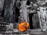 A Buddhist Monk Relaxes in the Bayon Temple  Angkor  Unesco World Heritage Site  Cambodia