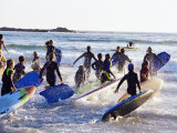 Teenage Surfers Running with Their Boards Towards the Water at a Life Saving Competition