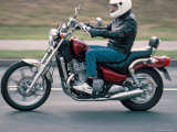 Motorcyclist Rides Suzuki Twin Motorcycle on Highway  Dawlish  Devon  England