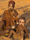 Karo Woman with Child Wearing Traditional Goatskin Dress Decorated with Cowrie Shells