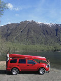 Couple Unloading Canoe at Mirror Lake  off Seward Highway  Chugach Mountain Range  Anchorage