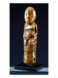 A Kongo Ivory Staff Finial Depicting a Kneeling Female Figure Holding a Child