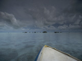 Clouds Boil Up over the Shallow Waters of Aldabra at a Boat's Bow