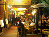 People Sitting at Outdoor Restaurants on Lygon Street at Night  Melbourne  Victoria  Australia