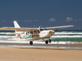 Plane About to Land on Seventy Five Mile Beach  Queensland  Australia