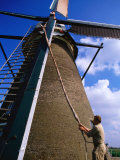 Miller Turning Sails to Stop Windmill in Kinderdijk  Zuid Holland  Netherlands