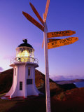 Signpost in Front of Lighthouse at Dawn  Cape Reinga  New Zealand