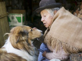 Elderly Female Vendor at Mercado de Los Brujas with Her Dog  La Paz  Bolivia