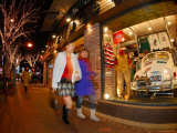 Women Walking Past Shop Window with Car in It  Hongik  Seoul  South Korea