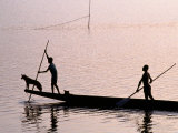 Two Men and a Dog in a Canoe  Silhouetted  Rabaul  East New Britain  Papua New Guinea