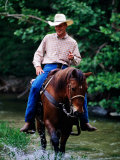 Cowboy on Horse in Medina River  Mayan Dude Ranch  Bandera  Texas