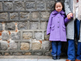 Young Girl Standing Against Stone Wall  Seoul  South Korea