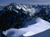 Skiers and Climbers Head Out over Aiguille du Midi with Matterhorn Point Peak  Chamonix  France