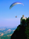 Person Hang-Gliding over Castle with Countryside Beyond  San Marino  San Marino