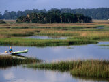 Man in Outboard Canoe on Moon River  Tybee Island  Georgia