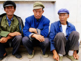Group of Three Seated Men at Cheng Gong Near Kunming  Yunnan  China